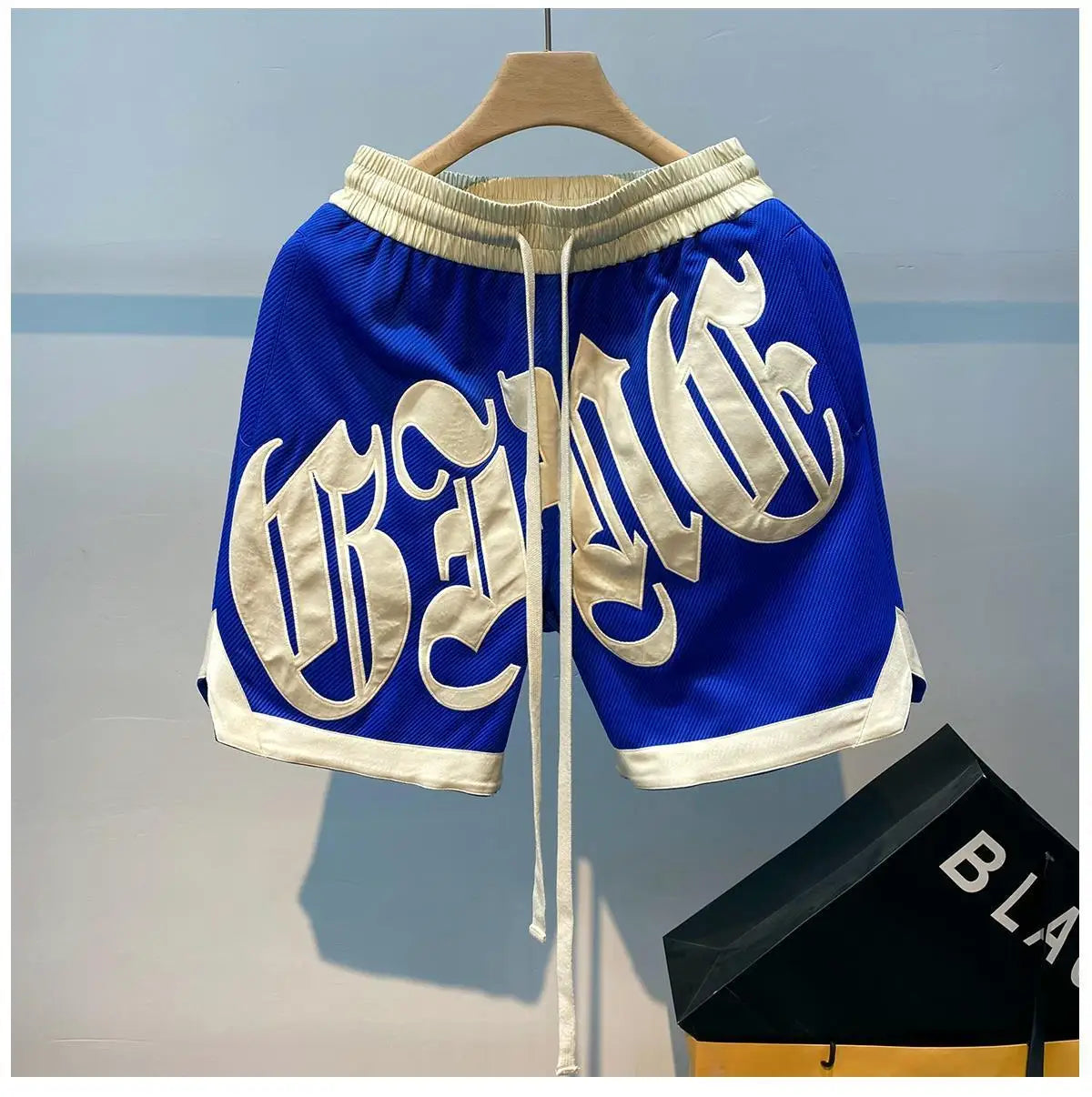 The new 2023 popular logo American joker ins summer leisure fashion men's trousers new handsome letter easy 5 minutes of pants