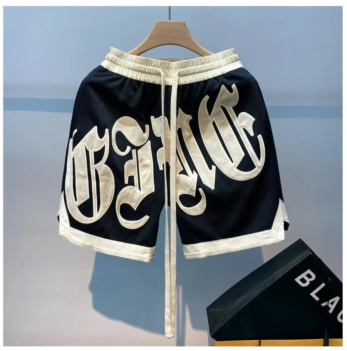 The new 2023 popular logo American joker ins summer leisure fashion men's trousers new handsome letter easy 5 minutes of pants