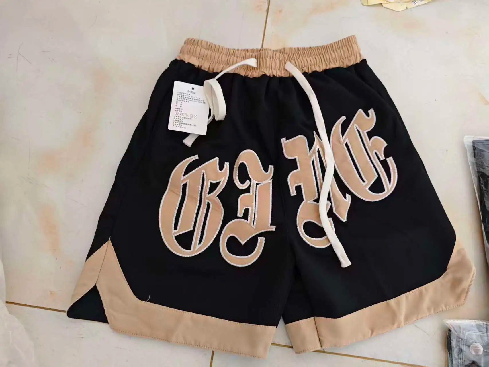 The new 2023 popular logo American joker ins summer leisure fashion men's trousers new handsome letter easy 5 minutes of pants