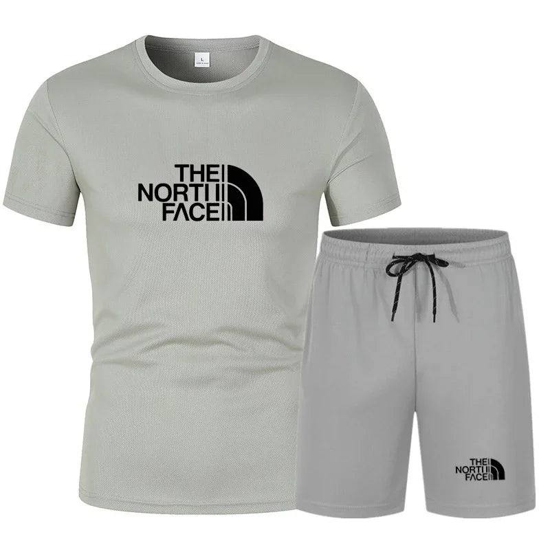 The new slim-fit men's mesh sports outfit includes a T-shirt and trousers, a two-piece set. It is a fashionable sports outfit in