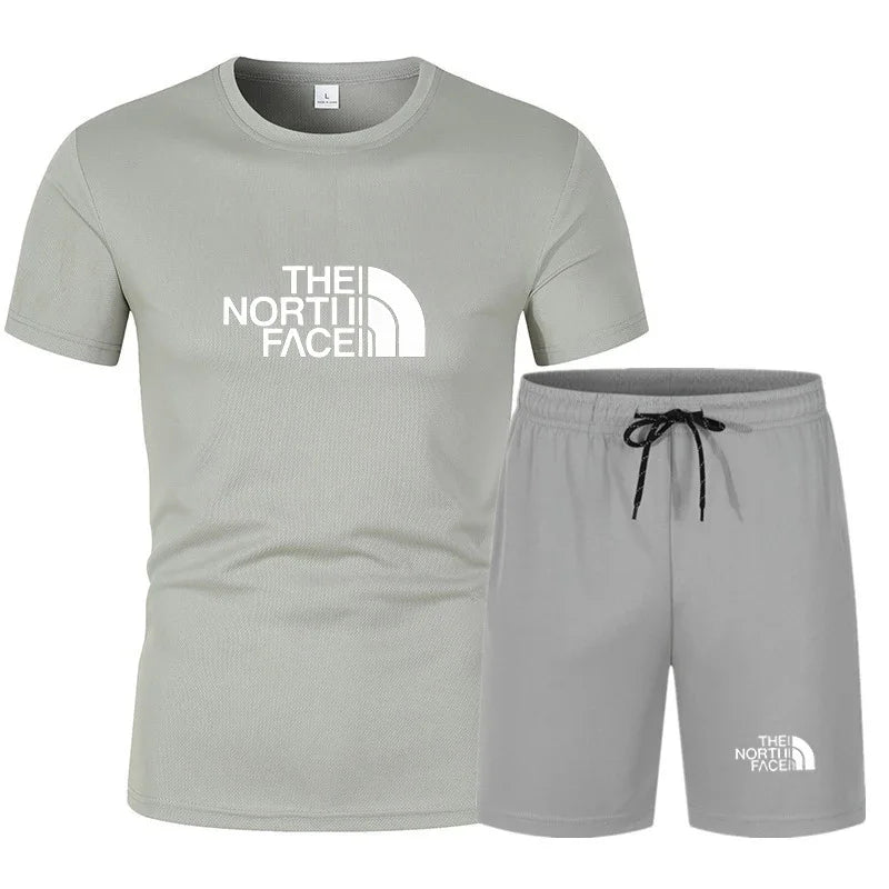 The new slim-fit men's mesh sports outfit includes a T-shirt and trousers, a two-piece set. It is a fashionable sports outfit in